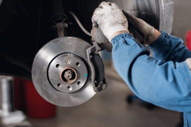 hand fixing car brake disk